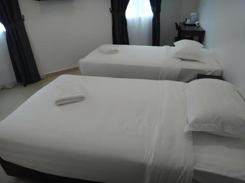 Katil atau katil-katil dalam bilik di Hotel Seri Geliga