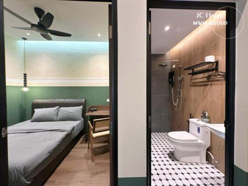 a small bedroom with a bed and a bathroom at Jalan Rusa Happy hour 10pax KTV Walkable to KSL Mall Johor Bahru in Johor Bahru
