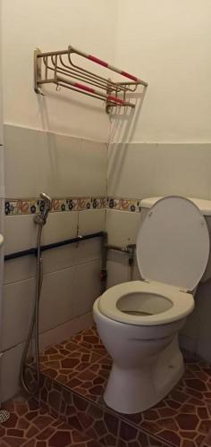 a bathroom with a white toilet in a room at OYO 90785 Pandan Hotel in Kota Kinabalu