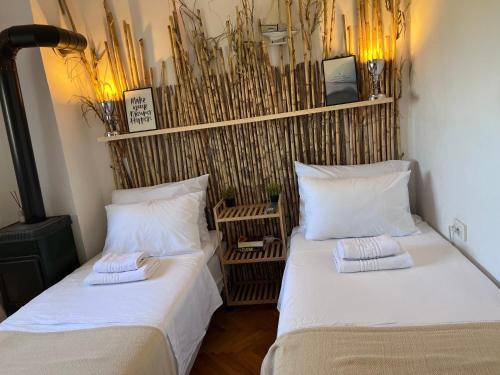 two beds sitting next to each other in a room at Villa Mandarin in Opuzen