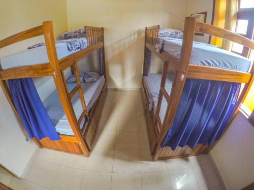Ένα ή περισσότερα κρεβάτια σε δωμάτιο στο Don Preguiça Hostel