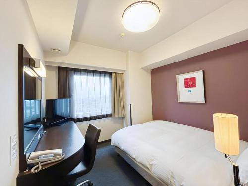 Телевизор и/или развлекательный центр в Hotel Route Inn Hirosaki Ekimae