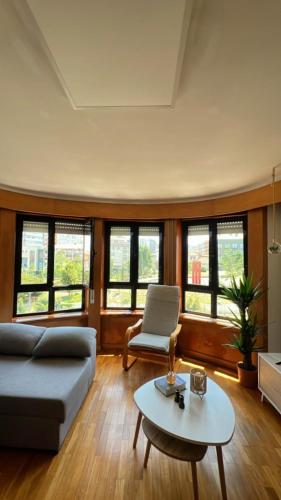 a living room with a couch and a table at House of Tranquility in Vila Nova de Gaia