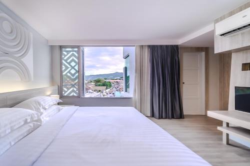 Voodi või voodid majutusasutuse Best Western Chaweng Samui toas