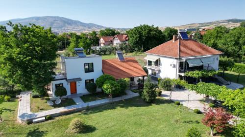 an aerial view of a house with a yard at Villa Number 6 - apartment complex in Skopje