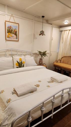 two beds sitting next to each other in a bedroom at Rococo by Concordia Hospitality in Shillong