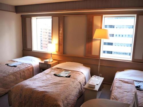 Katil atau katil-katil dalam bilik di Sanside Hotel