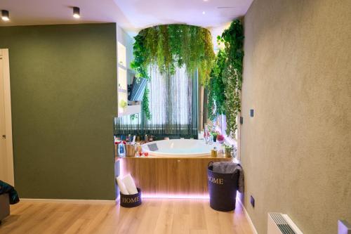 a bathroom with a tub and a large window at Nishan 249 in Cosenza