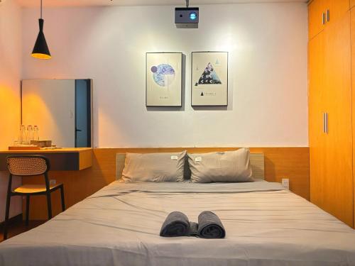 Ένα ή περισσότερα κρεβάτια σε δωμάτιο στο Hunas Homestay