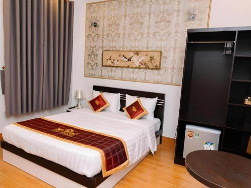 Кровать или кровати в номере Thinh Gia Phat Hotel Hoang Hoa Tham