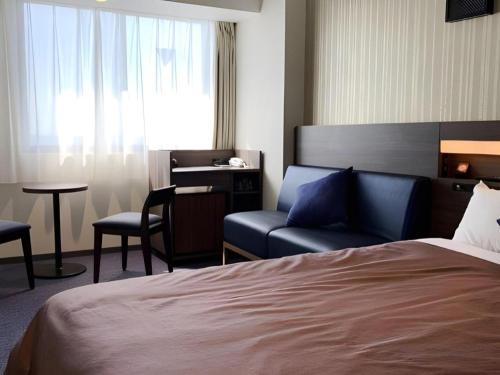 Кровать или кровати в номере HOTEL BAYGULLS