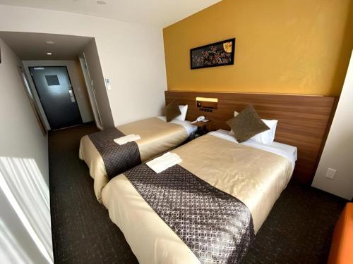 Кровать или кровати в номере HOTEL BAYGULLS