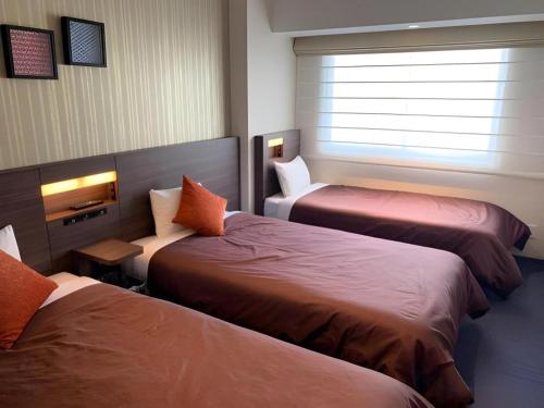 Кровать или кровати в номере HOTEL BAYGULLS