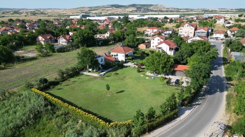 an aerial view of a house with a green yard at Villa Number 6 - apartment complex in Skopje