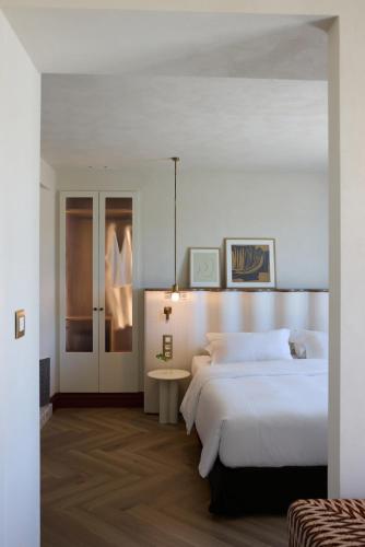 a bedroom with a large bed and a table at A for Athens in Athens