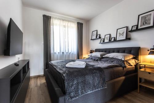 Ένα ή περισσότερα κρεβάτια σε δωμάτιο στο MAGDAROSA Resort