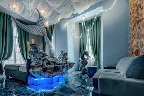 a living room with a couch and a table at Fairytale Athens Suites in Athens