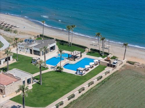 an aerial view of a house and the beach at Paralia Beachfront Residence in Georgioupolis