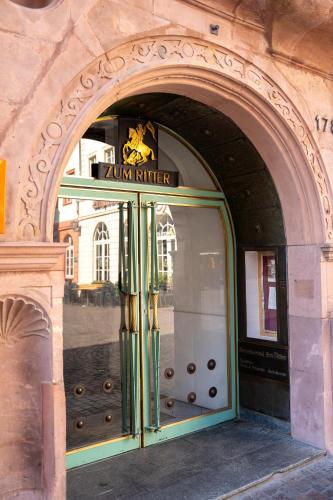 an entrance to a building with a glass door at Hotel zum Ritter in Heidelberg