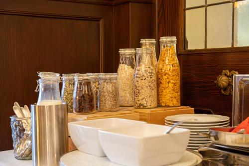 a group of glass jars filled with food on a counter at Hotel zum Ritter in Heidelberg