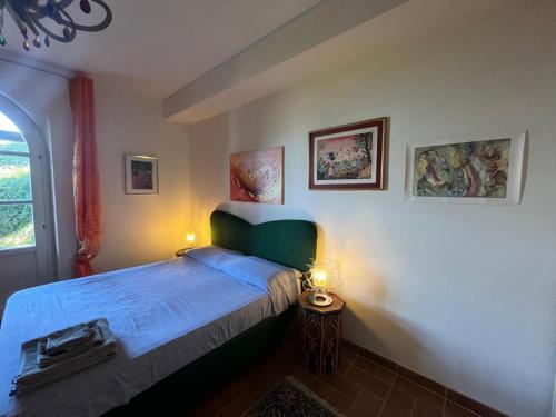 Una cama o camas en una habitación de La Dimora di Bacco