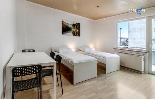 Postel nebo postele na pokoji v ubytování BEGE APARTMENTS FlexiStay