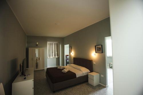 Letto o letti in una camera di 4 Balconi rooms Paladini B&B e appartamenti
