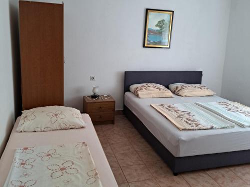 Posteľ alebo postele v izbe v ubytovaní APARTMAN PAVE & ILIJA jr