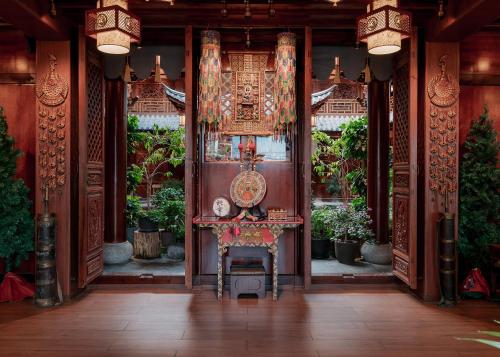 a chair in the middle of a room at Spirited Silky Inn丨Dali Old City in Dali