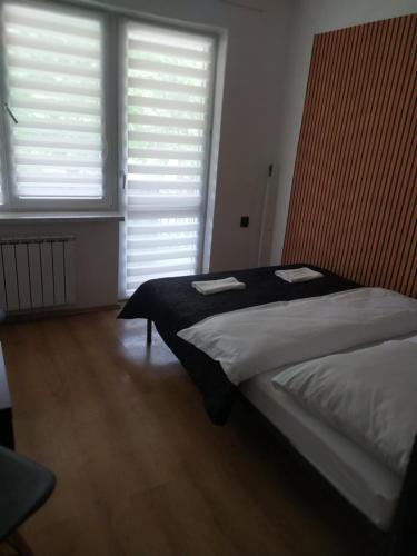 Katil atau katil-katil dalam bilik di Restauracja Hotel Koło do Wozu