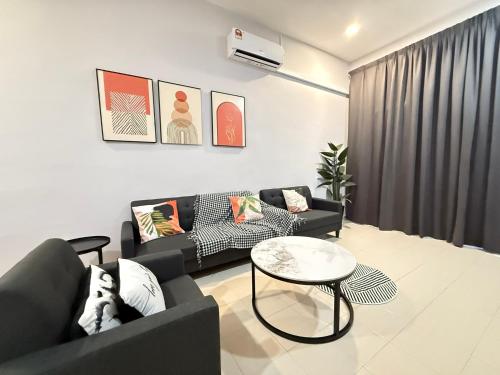a living room with two couches and a table at FunkyVila3 8PAXNear188Tower, ArtStreet, HTTA in Kuantan