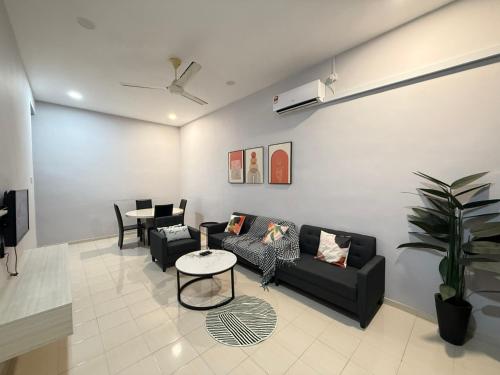 a living room with a couch and a table at FunkyVila3 8PAXNear188Tower, ArtStreet, HTTA in Kuantan