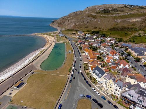 an aerial view of a town next to the ocean at Plas Gorwelion guest house - Adult only in Llandudno