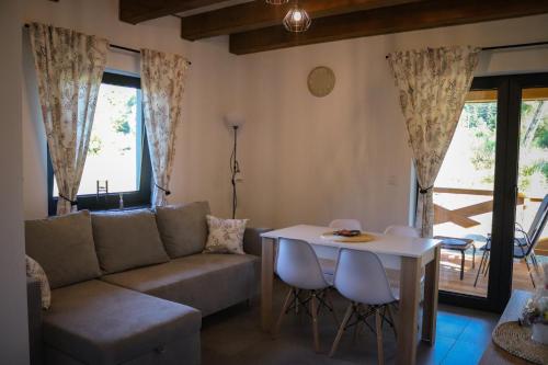 a living room with a couch and a table at Agroturystyka BieszCzadowa Dolina Cisna in Cisna