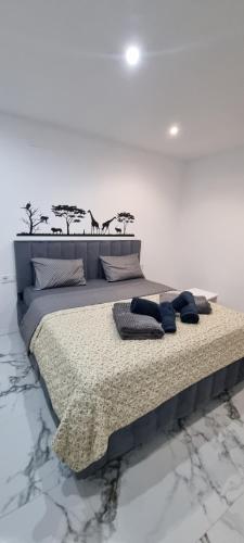 a bedroom with a large bed with animals on it at Victory in Alicante
