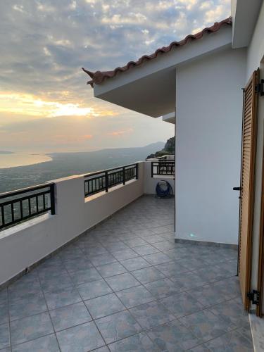 a balcony with a view of the ocean at Modern apartment in Mesochori 
