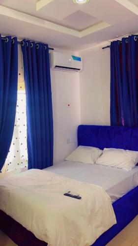 Llit o llits en una habitació de Temi41HOUSE
