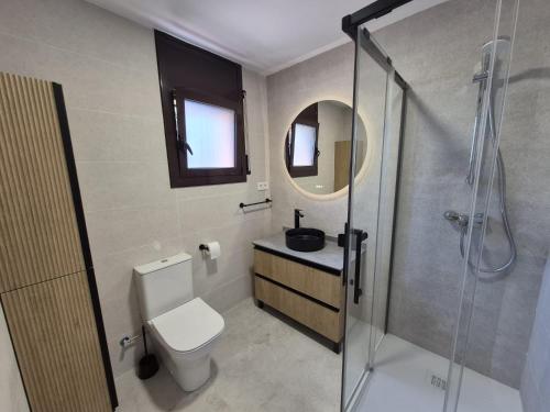 a bathroom with a toilet and a sink and a shower at Bravaholidays-600-Mas Altaba in Terra Brava