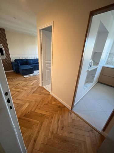 a view of a living room with a mirror at Very luxurious apartment in Paris - 10 min de la tour eiffel in Boulogne-Billancourt