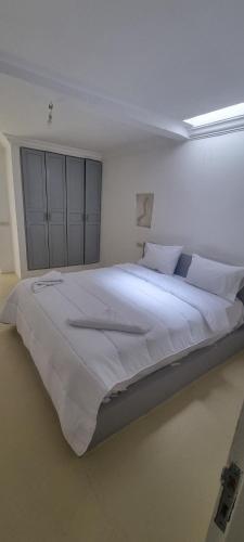 Ένα ή περισσότερα κρεβάτια σε δωμάτιο στο VILLA Malaika