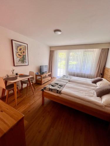 Ένα ή περισσότερα κρεβάτια σε δωμάτιο στο Appartements Elan