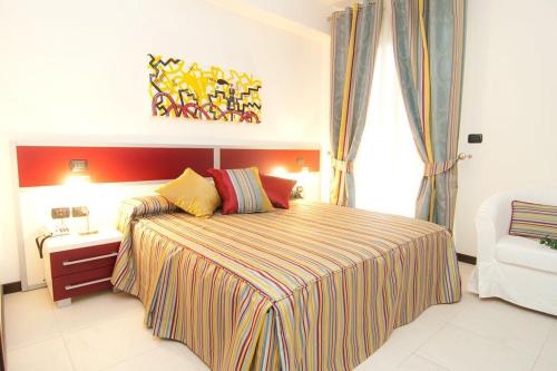 Postel nebo postele na pokoji v ubytování B&B Vescovo Rosso