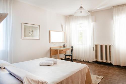 Letto o letti in una camera di Fattoria Busa dell'Oro