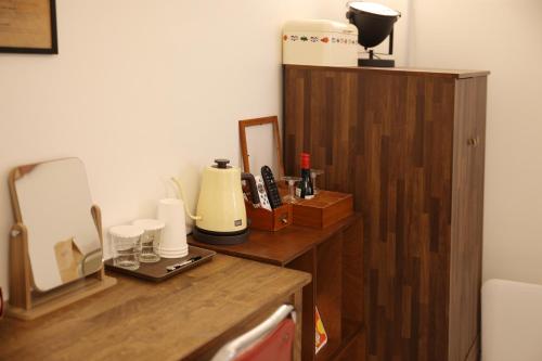 a kitchen with a wooden counter top with a blender at Pyeongtaek 1981 in Pyeongtaek