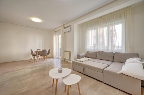 a living room with a couch and a table at Maturana by Clabao in Logroño