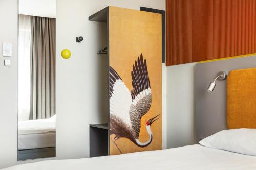 Postel nebo postele na pokoji v ubytování Qubus Hotel Żory