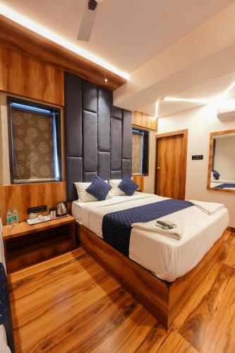 a bedroom with a bed on a boat at Hotel Prince Palace in Mumbai