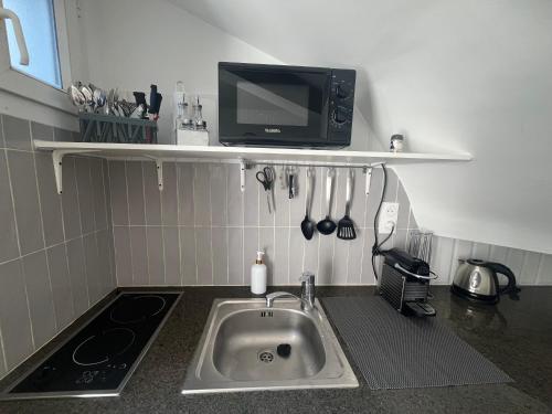Η κουζίνα ή μικρή κουζίνα στο Cosy Home - Studio terrasse à 2 pas de Paris