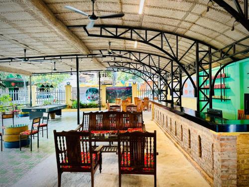 a dining room with a table and chairs at Loop Central Stay Tour & Motorbike Rental in Ha Giang
