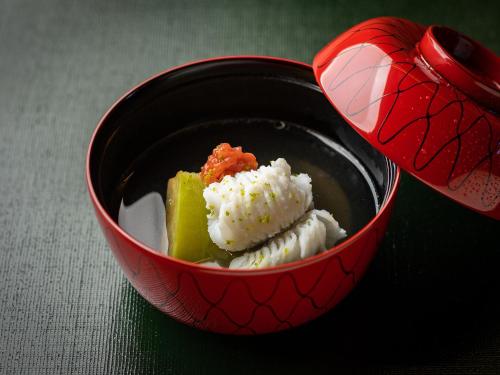 a red bowl with food in it with a heart at TSUCHIYA Kinosaki onsen in Toyooka